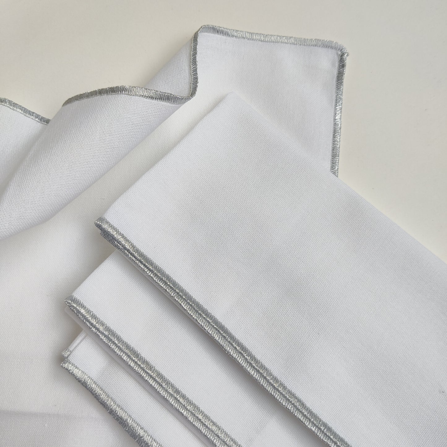 Whimsical Silver white Zari embroidered Napkin